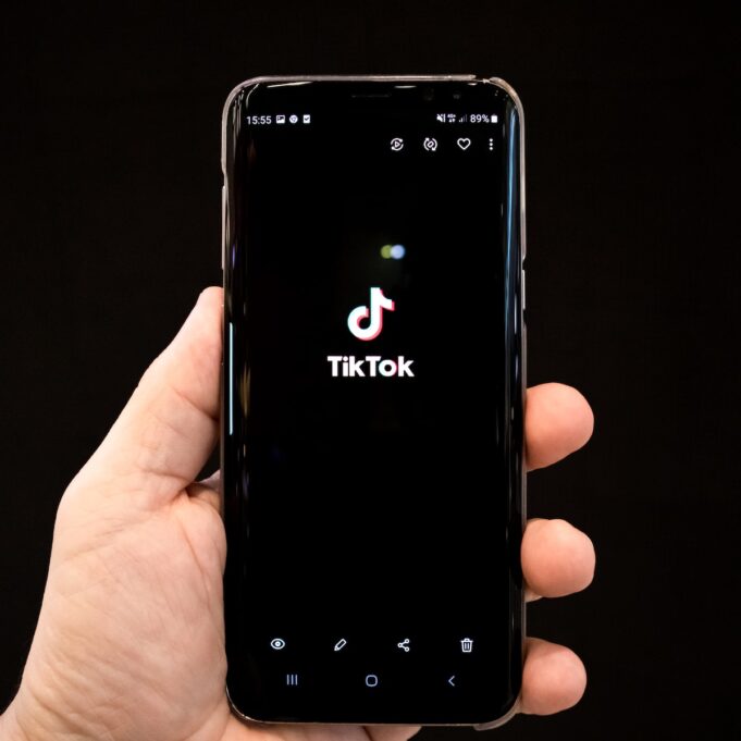 black android smartphone displaying 12 00